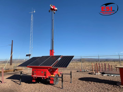 a red mobile security trailer with a black solar panel offering industry specific security 